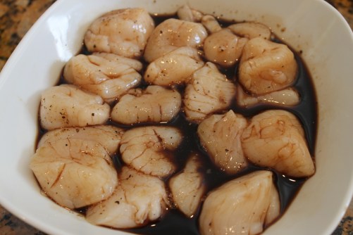 Scallops marinating in balsamic vinegar 